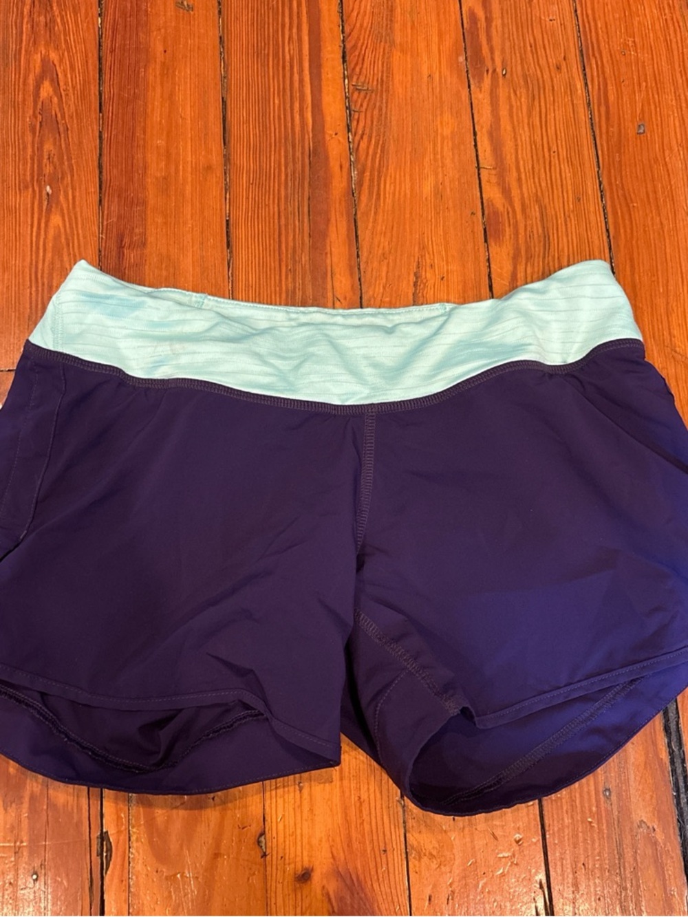 Pearl Izumi Women's Athletic Shorts in Navy with Mint Waistband